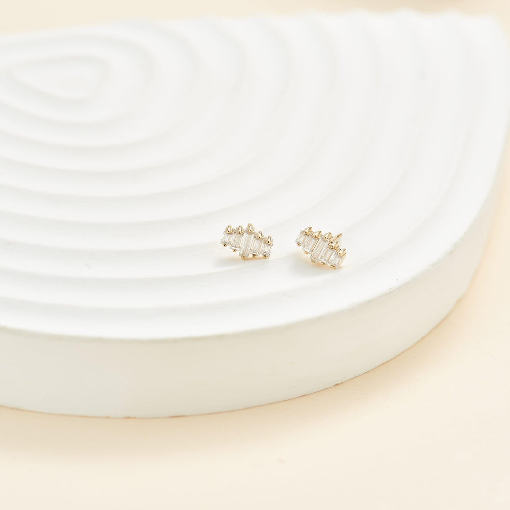 detail close-up of 14K solid gold baguette-cut lab diamond flat back stud earring nickel-free