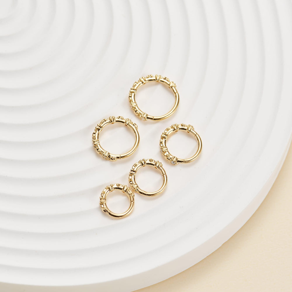 detail close-up of 14K solid gold lab diamond for conch piercing clicker hoop earring nickel-free