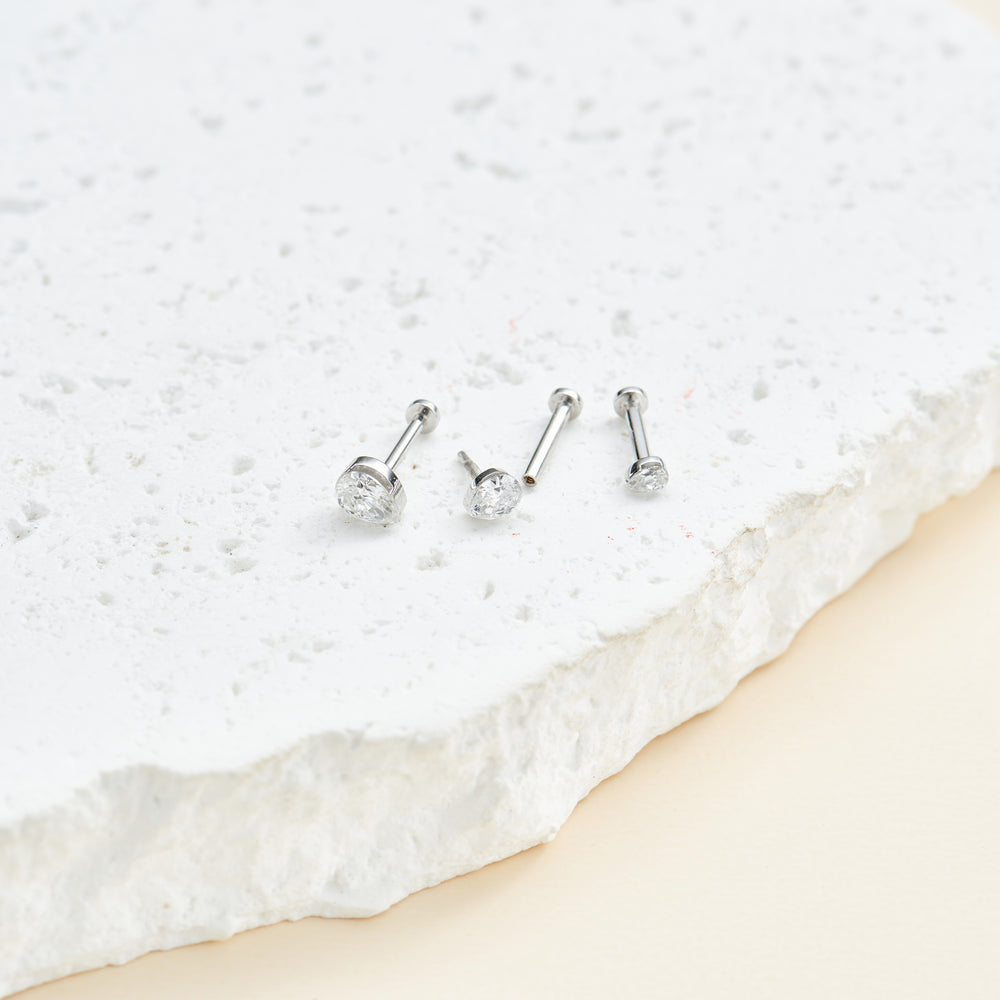 product angle view of 14K white gold pear-cut lab diamond invisible setting flat back stud earring internal thread design ...