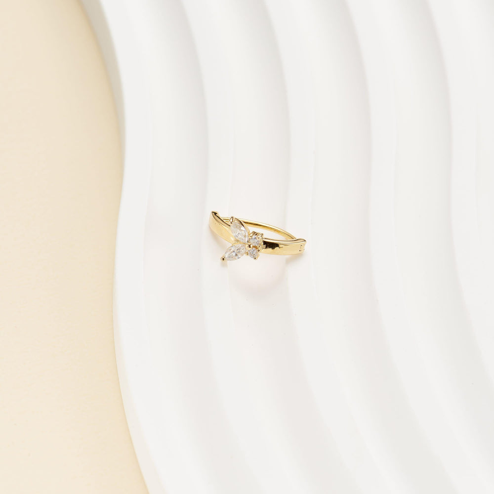 detail close-up of 14K solid gold marquise-cut lab diamond butterfly for navel piercing belly button ring nickel-free