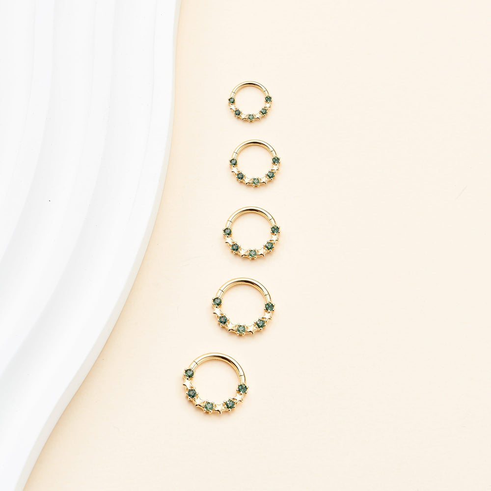 detail close-up of 14K solid gold moss agate star-shaped for daith septum piercing clicker hoop earring nickel-free