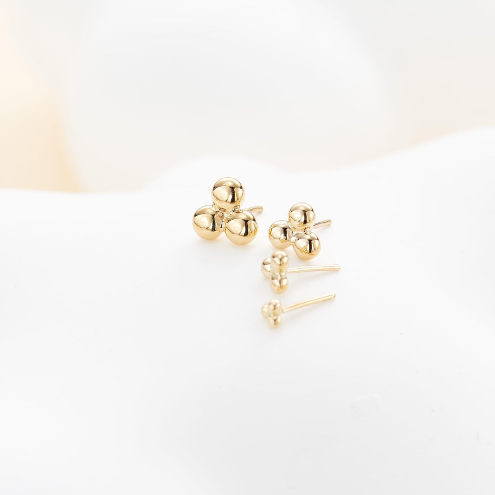 worn on model - 14K solid gold trinity knot labret stud threadless design nickel-free