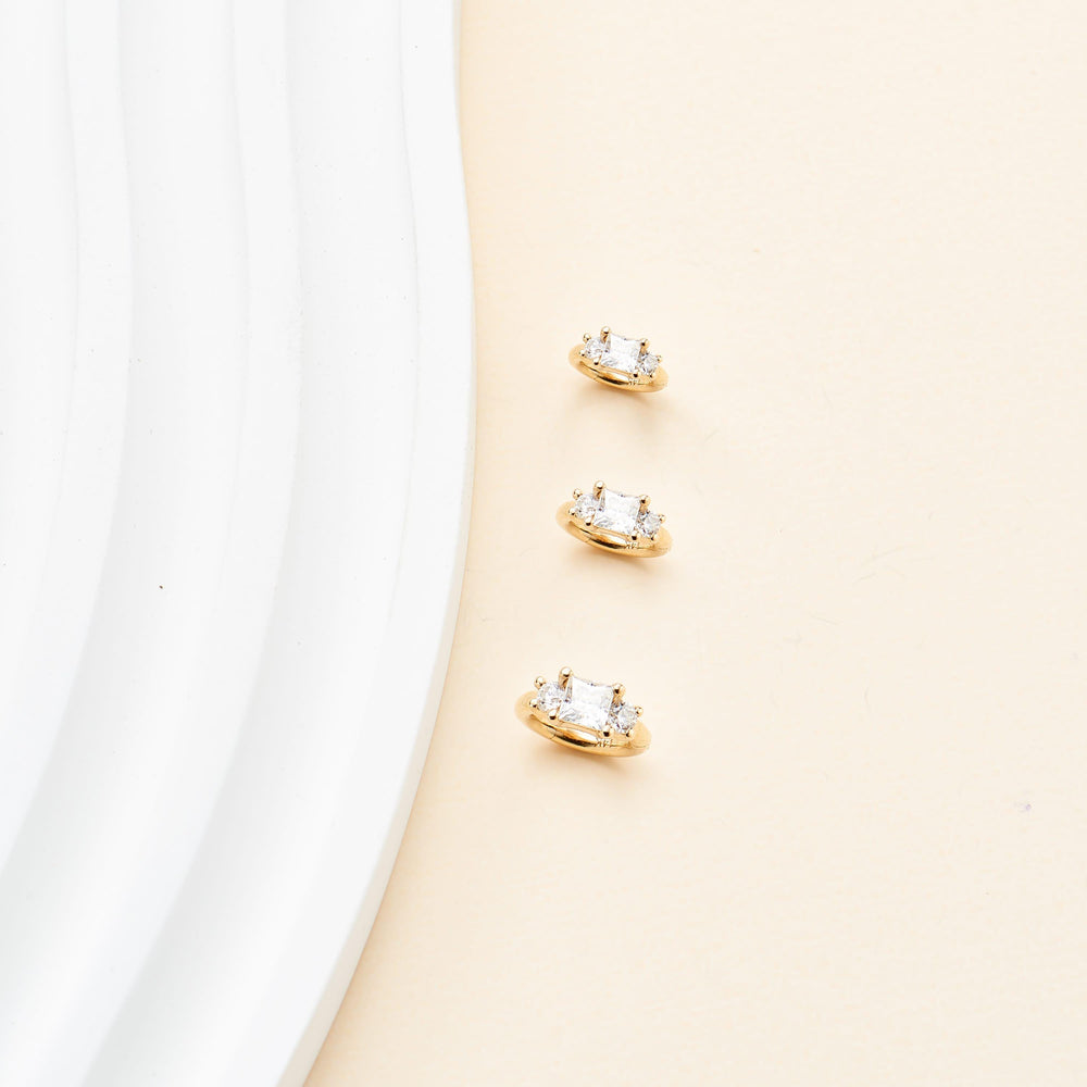 product angle view of 14K solid gold princess-cut lab diamond for helix tragus rook piercing clicker hoop earring nickel-free
