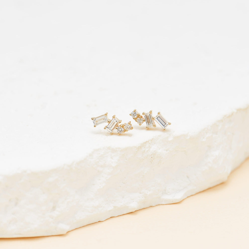detail close-up of 14K solid gold baguette-cut lab diamond for cartilage piercing flat back stud earring nickel-free