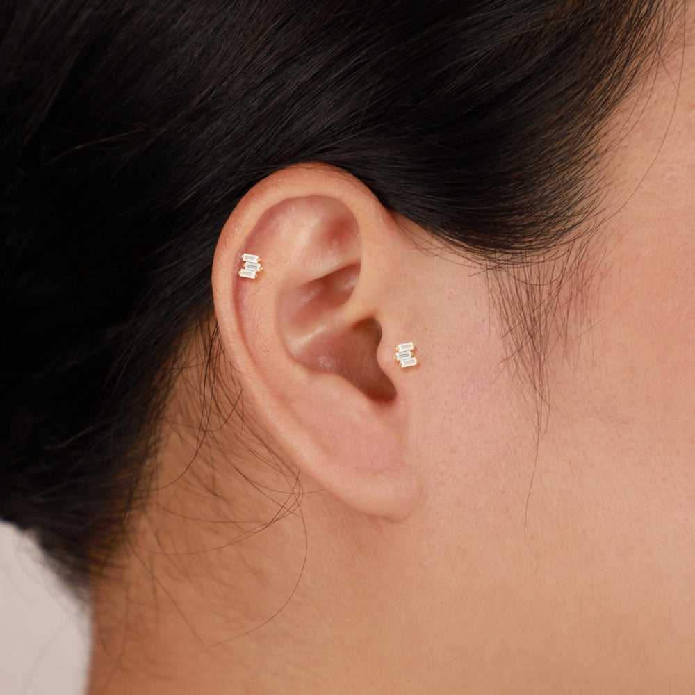 product angle view of 14K solid gold baguette-cut lab diamond flat back stud earring threadless design nickel-free
