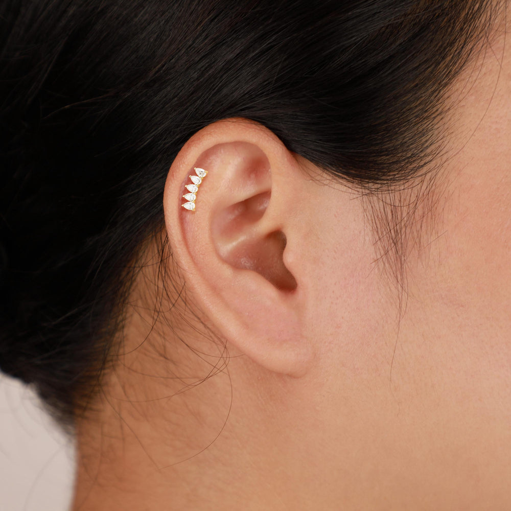 product angle view of 14K solid gold pear-cut lab diamond for helix piercing flat back stud earring threadless design nick...