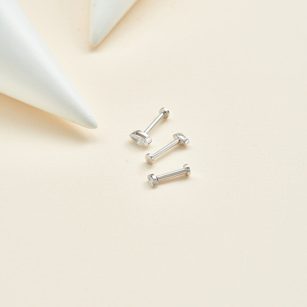 worn on model - 14K solid gold marquise-cut lab diamond invisible setting flat back stud earring screw back design nickel-...