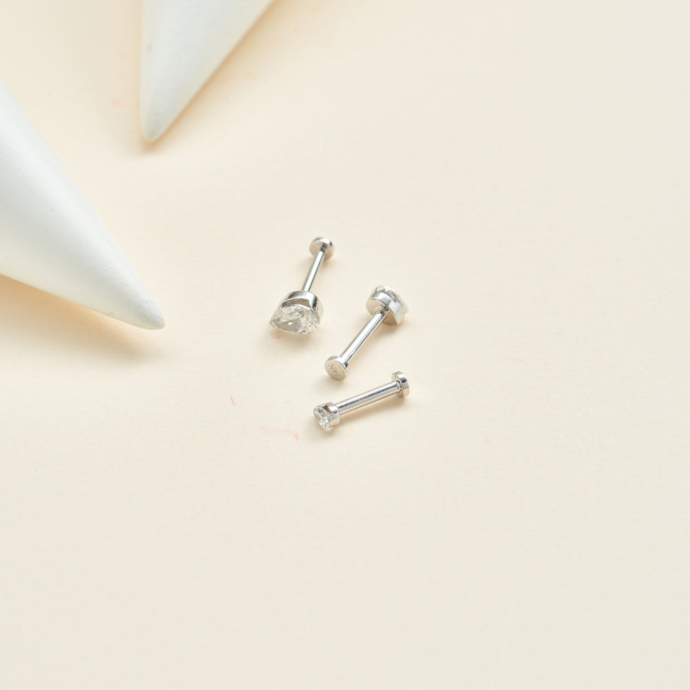 top view detail of 14K white gold pear-cut lab diamond invisible setting flat back stud earring internal thread design nic...