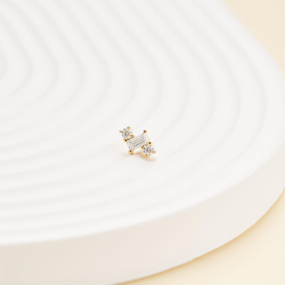 detail close-up of 14K solid gold baguette-cut lab diamond flat back stud earring threadless design nickel-free