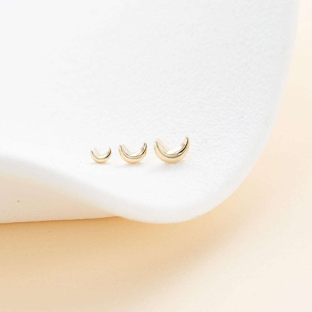 detail close-up of 14K solid gold crescent moon for cartilage piercing flat back stud earring threadless design nickel-free
