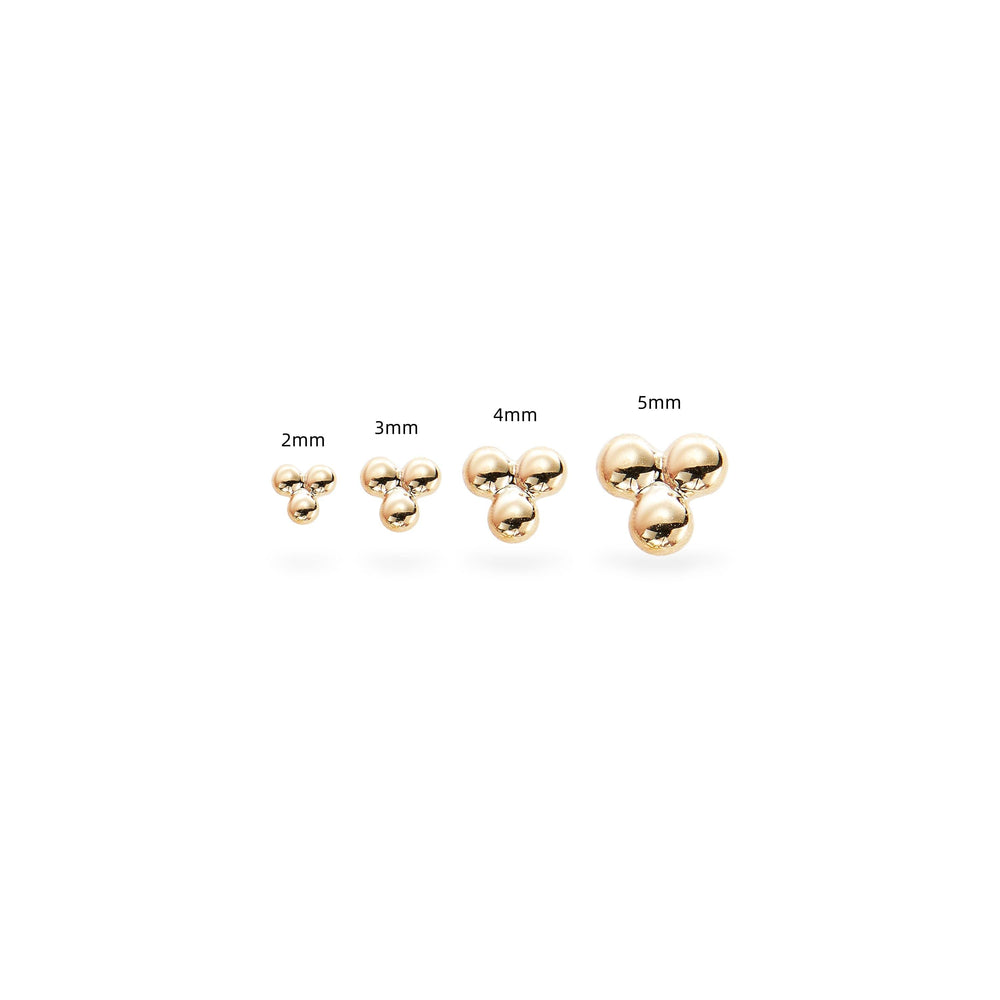 top view detail of 14K solid gold trinity knot labret stud threadless design nickel-free